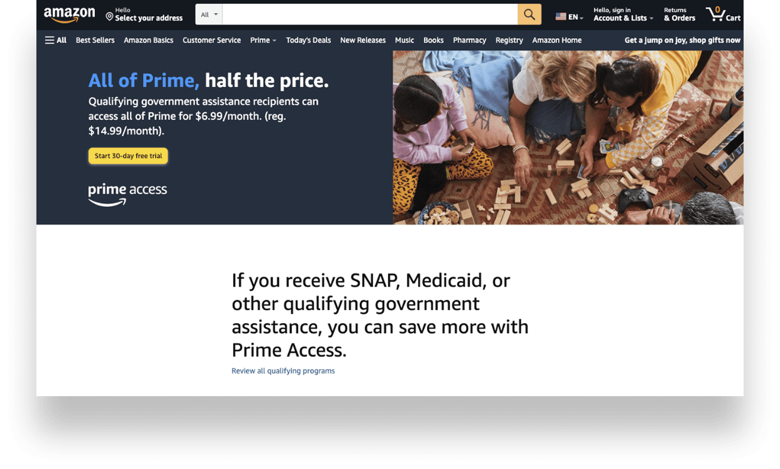 Amazon.com landing page with the Prime Access offer: “All of Prime, half the price.” panel beside family photography, and a note that SNAP, Medicaid, or other qualifying government assistance can save more with Prime Access.